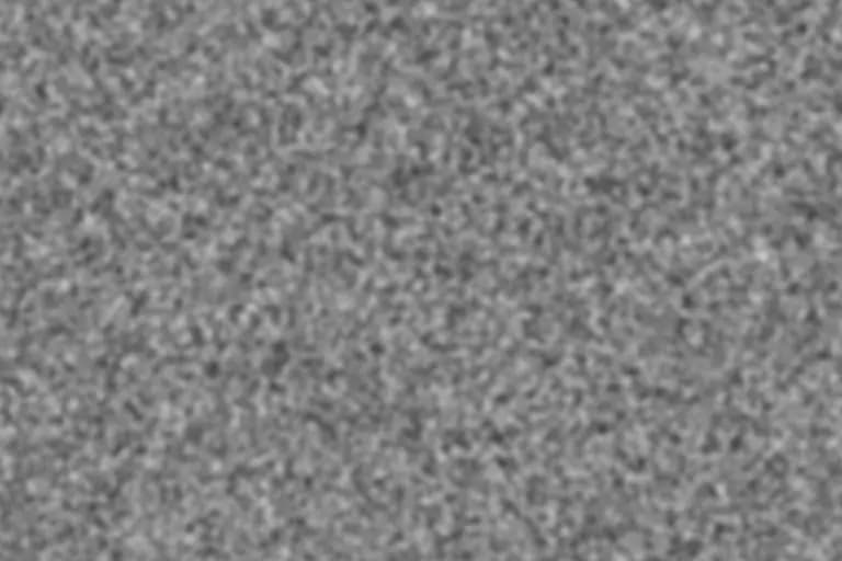 Neutral-gray 4K-scale film grain texture with fine, rounded clusters